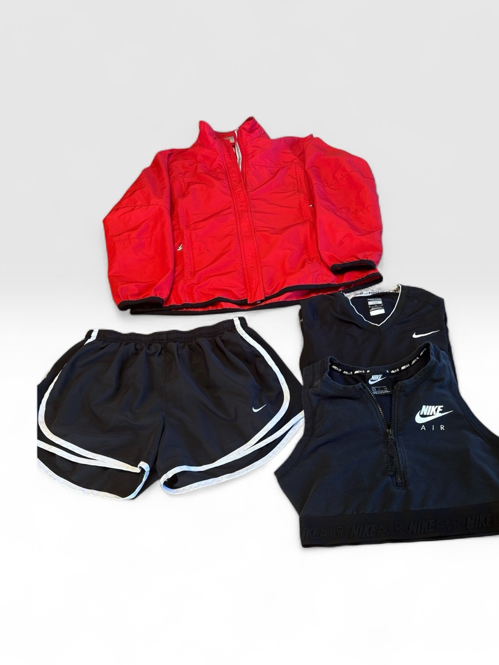 Nike Women’s Four Piece set,lightweight jacket with shorts, pullover and bra.